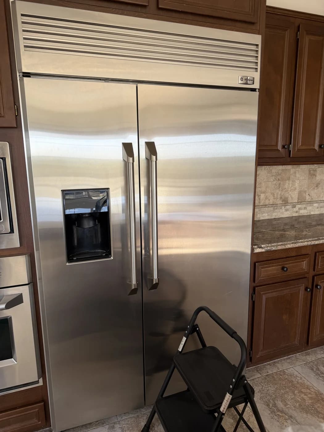 GE Monogram refrigerator interior serviced by OPUS in San Diego