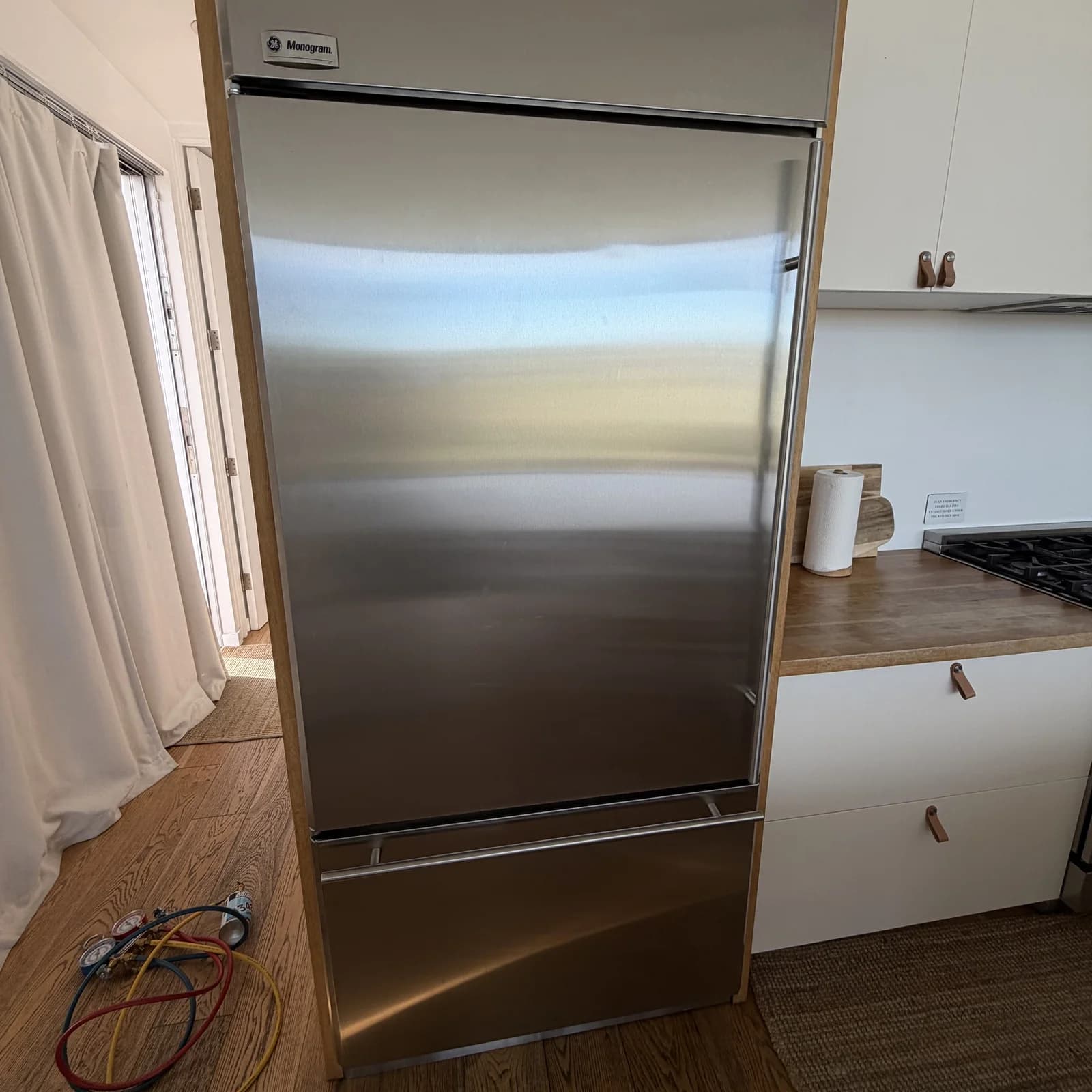 GE Monogram built-in refrigerator interior — OPUS service in Coronado