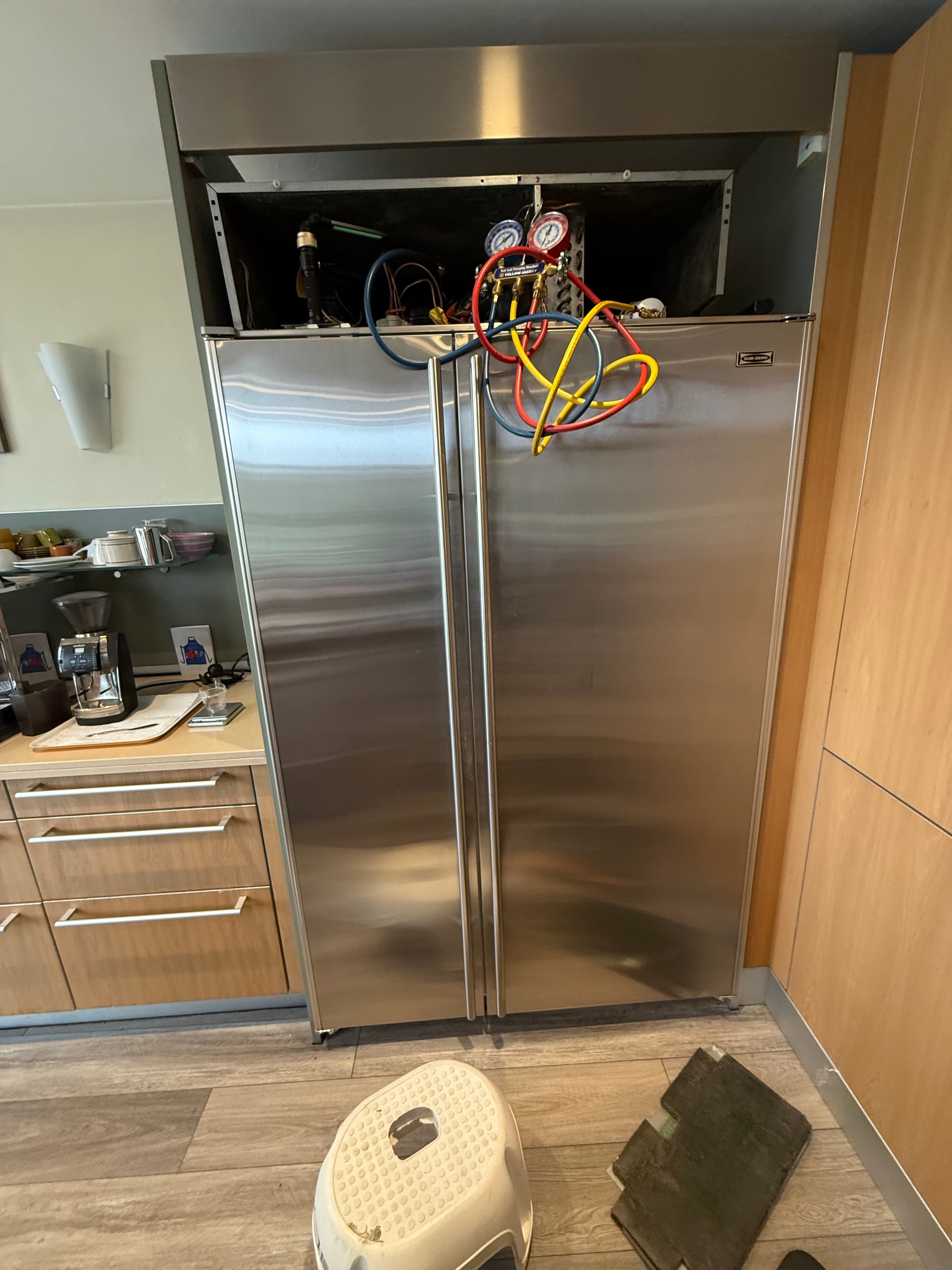 OPUS technician servicing a Sub-Zero refrigerator in San Diego