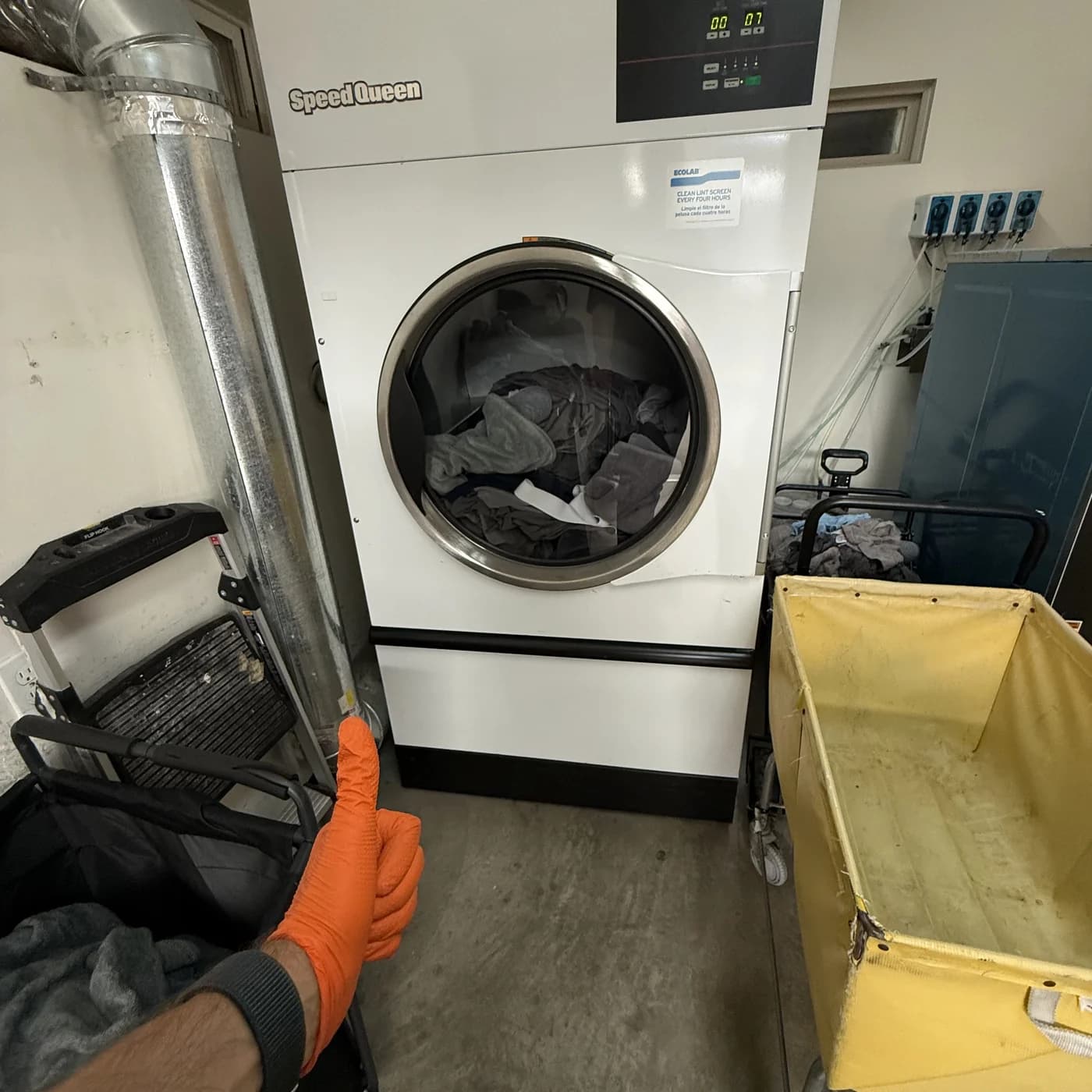 Speed Queen commercial washer in a hotel laundry — control board replacement by OPUS in San Diego